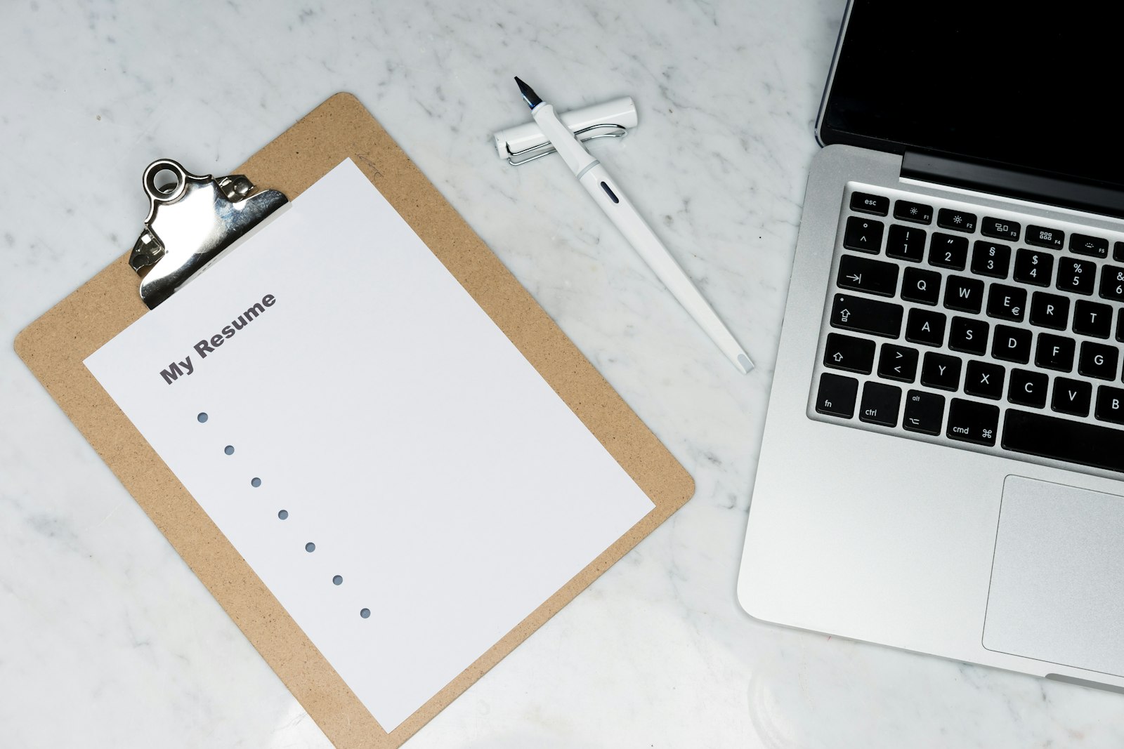Brand guidelines spread on a studio desk during an identity audit review